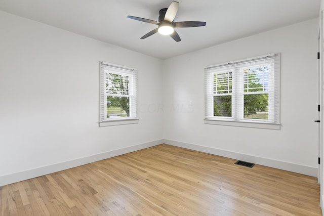 spare room featuring ceiling fan and light wood-type flooring