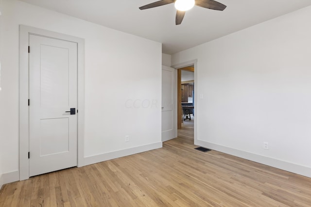 unfurnished bedroom featuring light wood-type flooring and ceiling fan