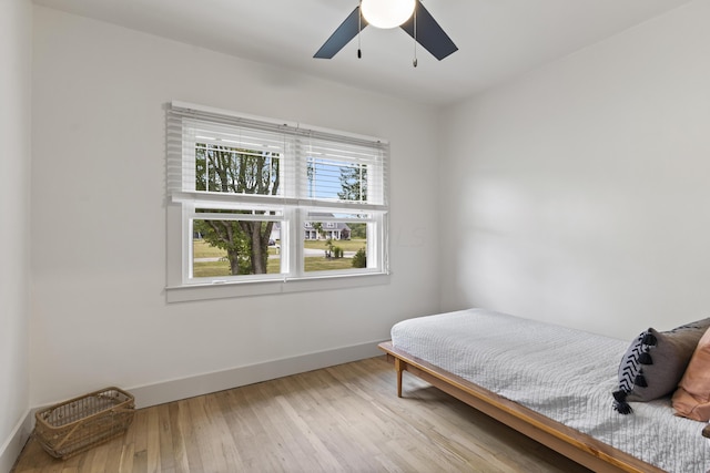 bedroom featuring light hardwood / wood-style flooring and ceiling fan