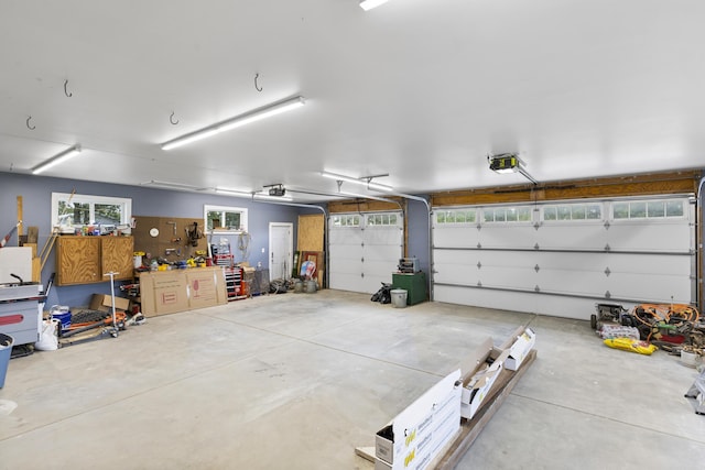 garage featuring a workshop area and a garage door opener