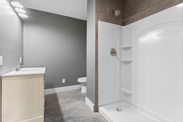 bathroom featuring vanity, toilet, concrete flooring, and walk in shower