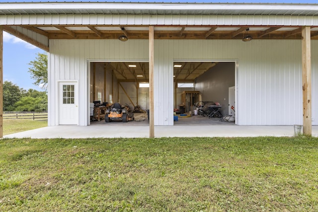 garage featuring a lawn