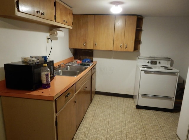 160 Commerce St, Lockbourne, OH 43137 - kitchen featuring white electric range, light countertops, and black microwave