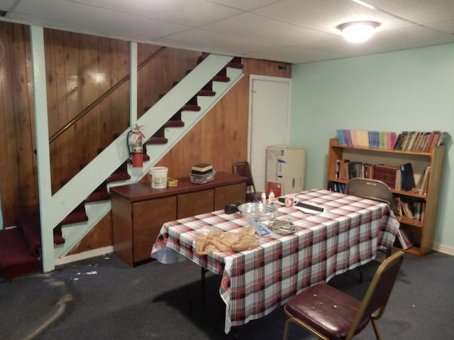 160 Commerce St, Lockbourne, OH 43137 - dining area featuring carpet flooring, stairs, wooden walls, and a drop ceiling