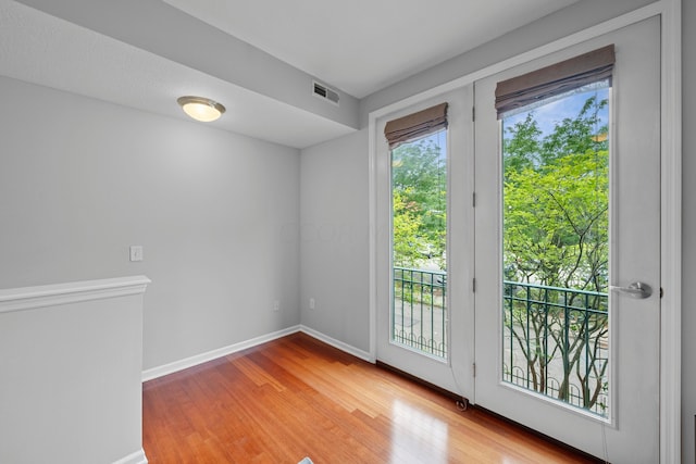 entryway with hardwood / wood-style flooring