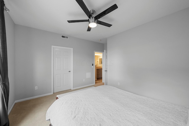 carpeted bedroom featuring connected bathroom and ceiling fan