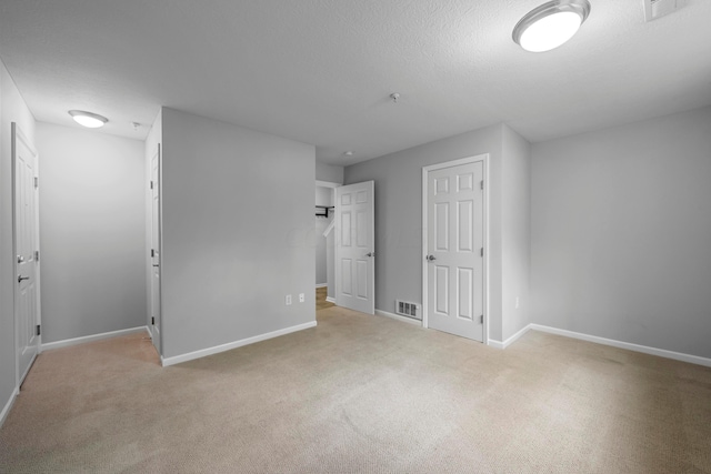 unfurnished bedroom with light carpet