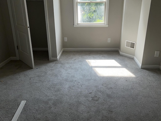 unfurnished bedroom with light colored carpet