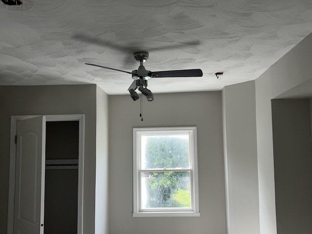 interior details featuring ceiling fan