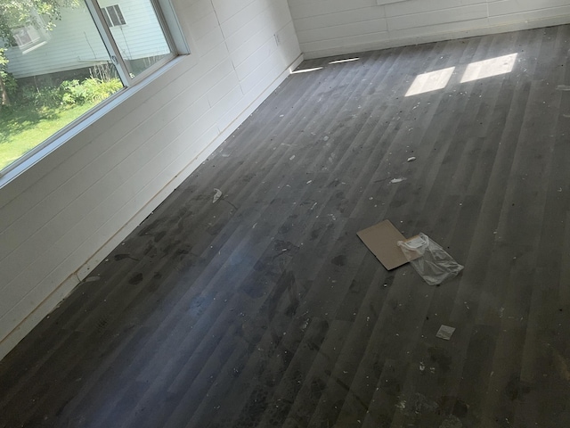 empty room with dark hardwood / wood-style flooring