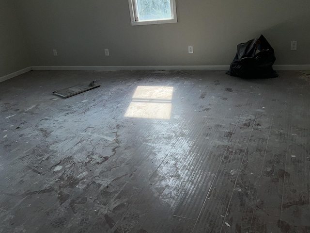 unfurnished room featuring hardwood / wood-style flooring