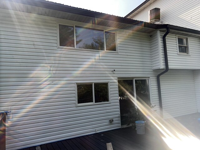 view of side of property featuring a wooden deck