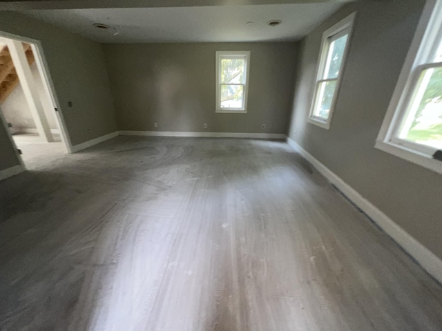 unfurnished room featuring hardwood / wood-style flooring