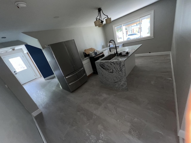 kitchen with sink, a notable chandelier, white cabinets, hanging light fixtures, and lofted ceiling