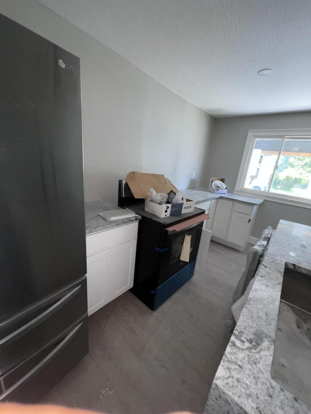 laundry area featuring dark hardwood / wood-style floors