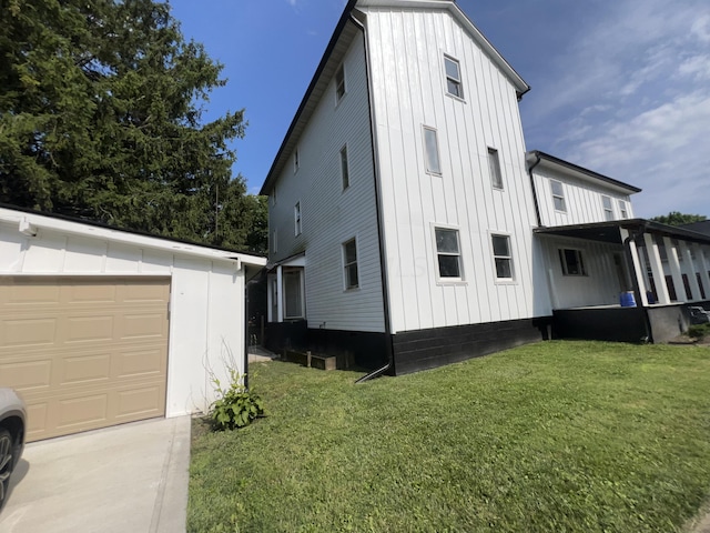 exterior space with a lawn and a garage