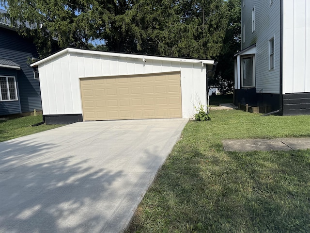 garage featuring a yard