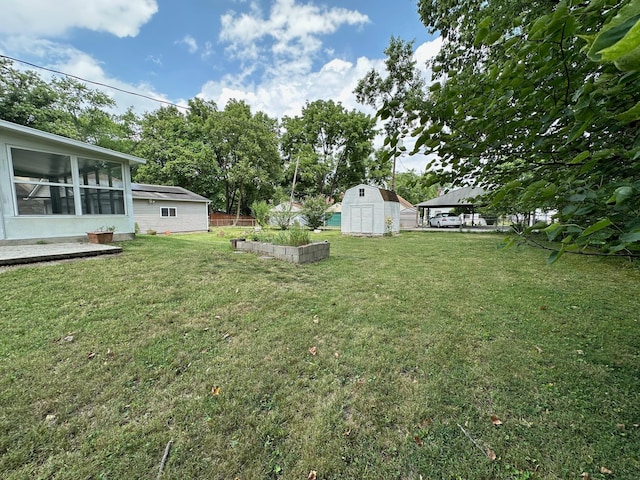 view of yard with a gazebo and a shed