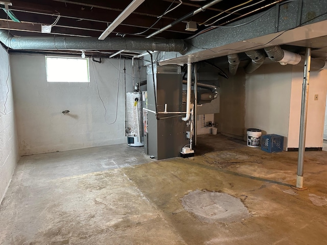 basement featuring heating unit and gas water heater