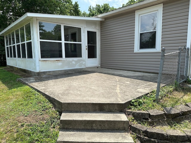 view of patio / terrace featuring a sunroom