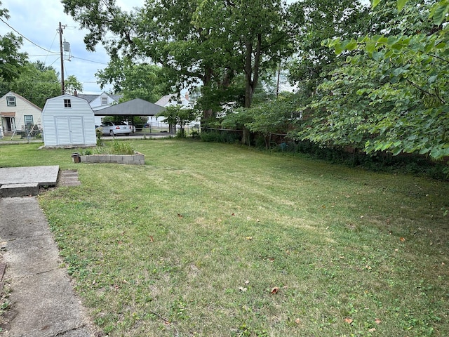 view of yard featuring a gazebo and a shed