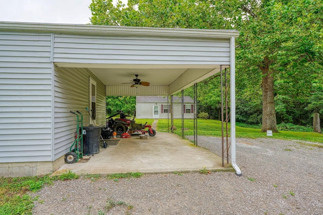 view of patio / terrace with a carport and ceiling fan