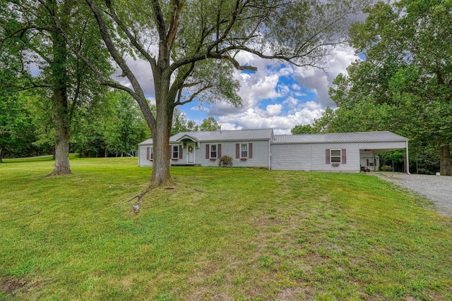 view of front of house with a front lawn and a carport