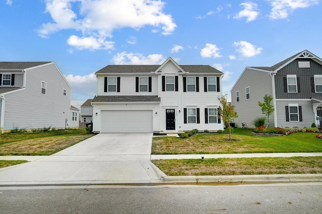 view of front facade with a garage and a front lawn