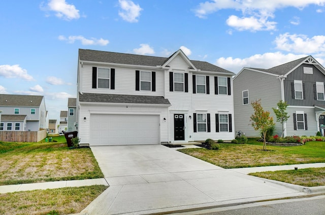 view of front of home featuring a front lawn and a garage