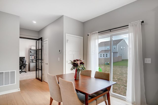 dining room with light wood-type flooring