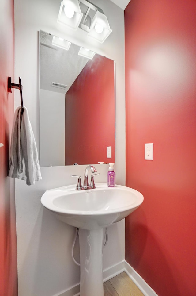 bathroom featuring hardwood / wood-style floors and sink