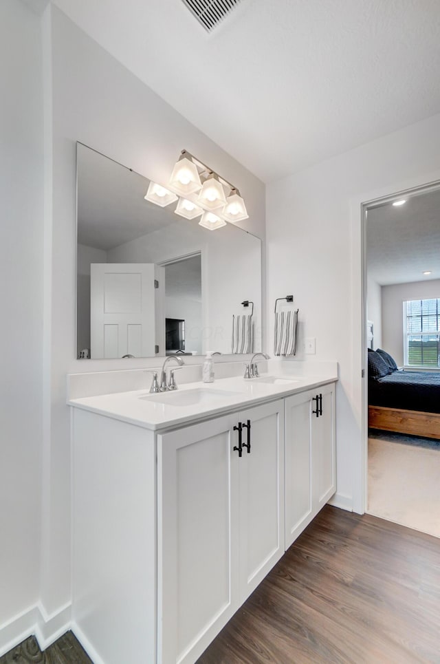 bathroom featuring vanity and wood-type flooring