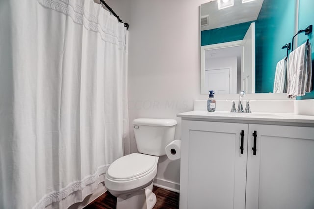 bathroom featuring a shower with curtain, vanity, toilet, and wood-type flooring