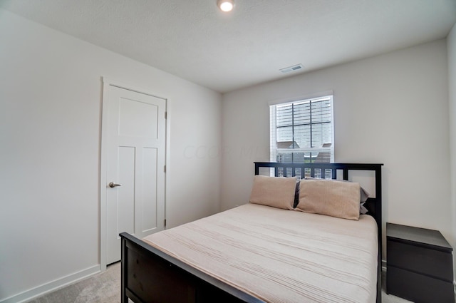 bedroom with light carpet