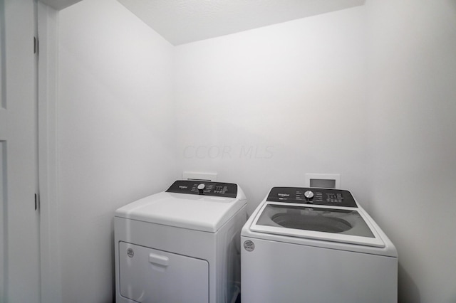 washroom with washing machine and dryer