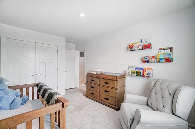 bedroom featuring light carpet