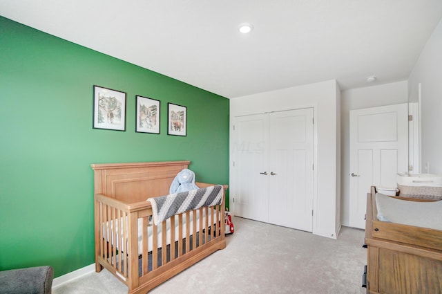 carpeted bedroom featuring a closet