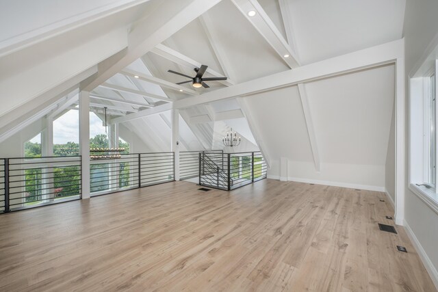 interior space featuring beamed ceiling, light wood-type flooring, high vaulted ceiling, and ceiling fan with notable chandelier