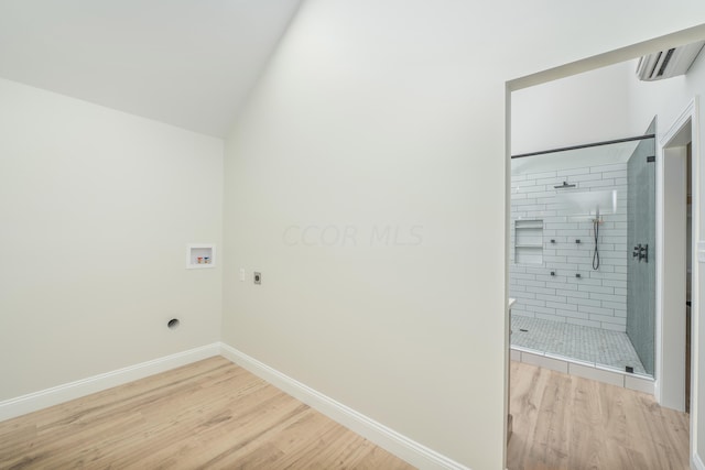 laundry room featuring electric dryer hookup, washer hookup, and hardwood / wood-style flooring