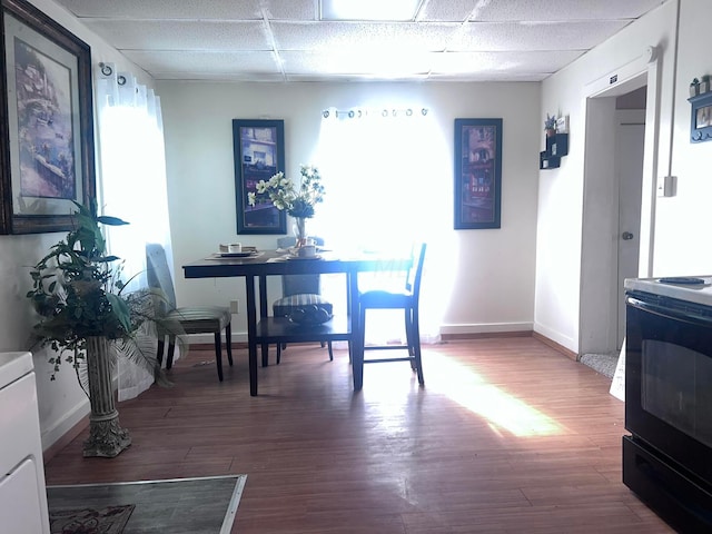 dining area with hardwood / wood-style floors