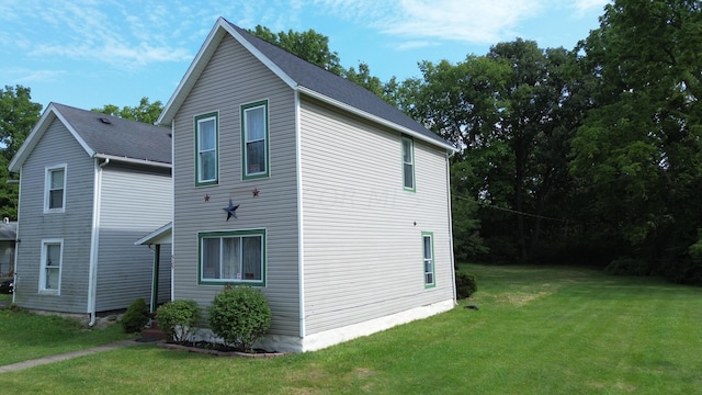 view of home's exterior featuring a yard