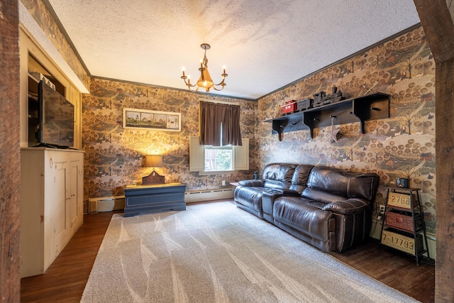 living room featuring ornamental molding, a textured ceiling, baseboard heating, a chandelier, and hardwood / wood-style floors