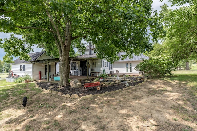 back of house with a patio