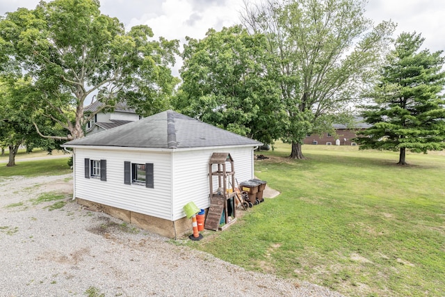 view of side of home featuring a lawn