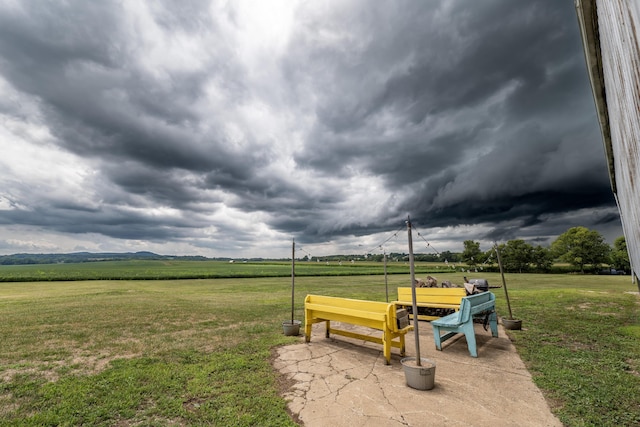 surrounding community with a lawn and a rural view