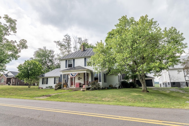 view of front of property featuring covered porch and a front yard