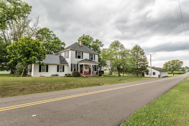 view of front of property featuring a porch and a front yard