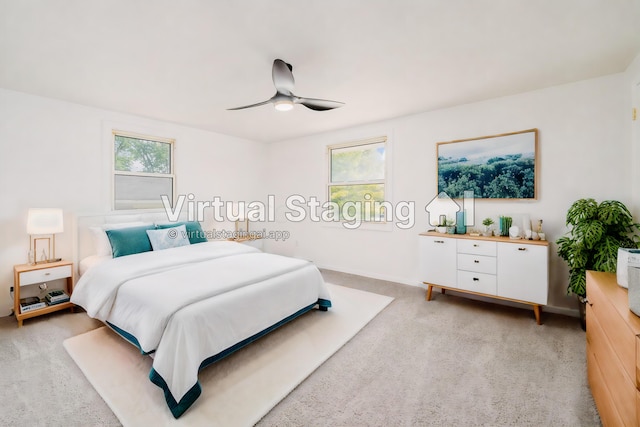 carpeted bedroom with ceiling fan