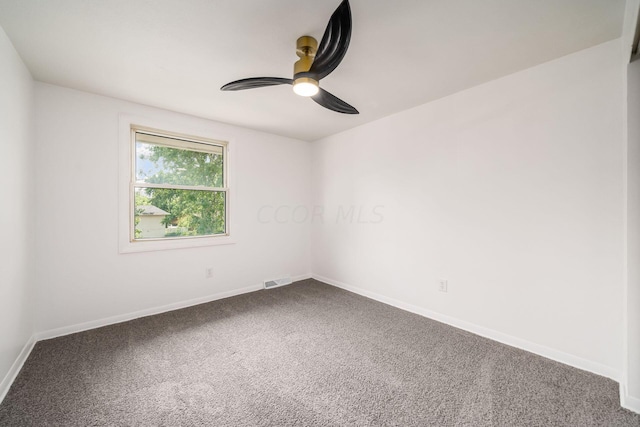 empty room featuring carpet flooring and ceiling fan