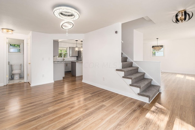 staircase with hardwood / wood-style flooring